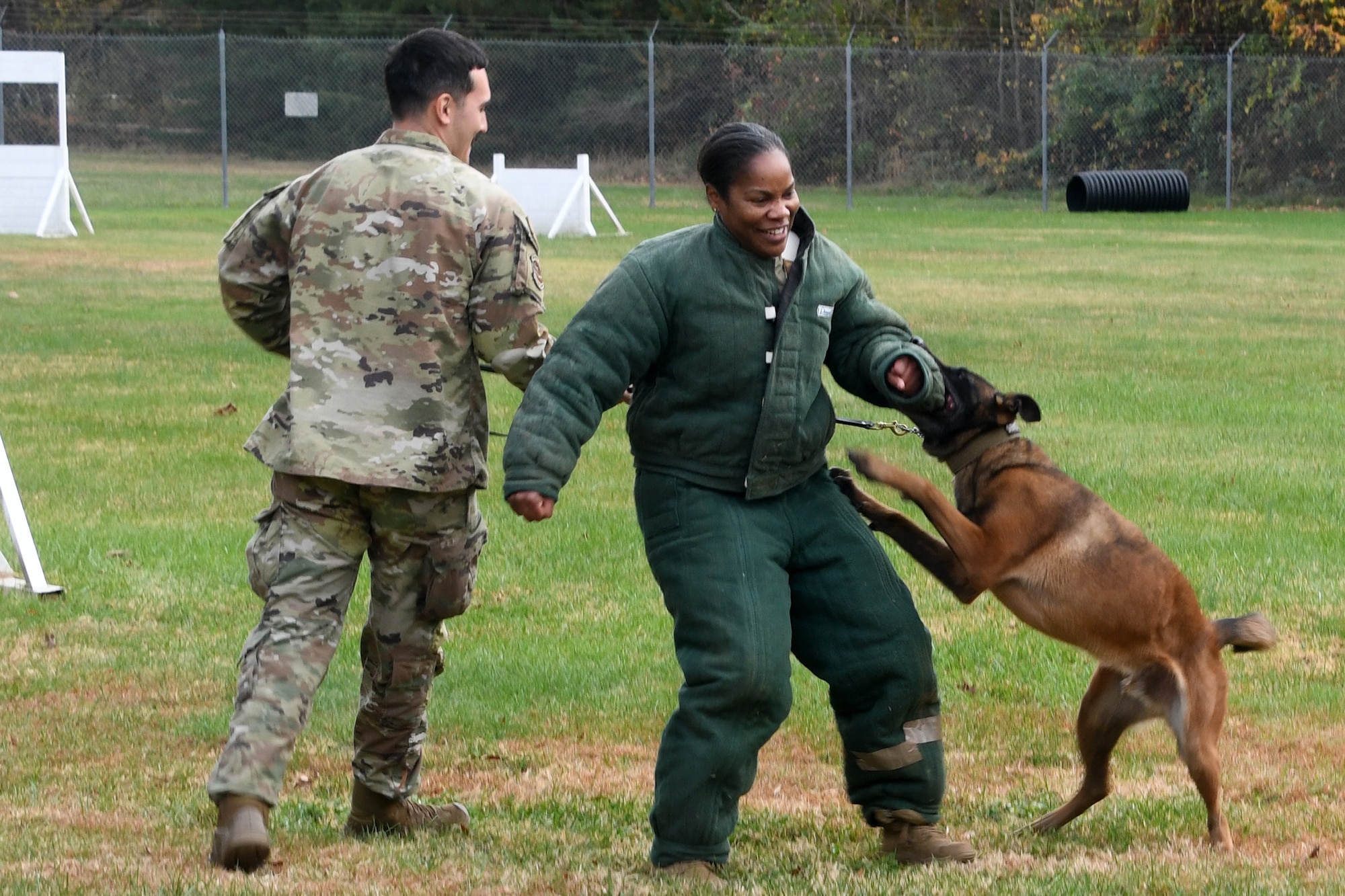 The 459th Mission Support Group Commander, Col. Vianesa Vargas, recently participated in a rite of passage for new MSG commanders with security forces under their command. She suited up in padded gear to face off against one of Joint Base Andrews' finest Military Working Dogs, 'Boss', on Nov. 15, 2023. Boss got to treat the colonel as a suspect and he apprehended her successfully on each encounter. This was an opportunity to familiarize herself with the type of training that is essential to the development and success of security forces Airmen and the JBA Working Dogs. (Air Force photo by Lt Col Timothy Smith)