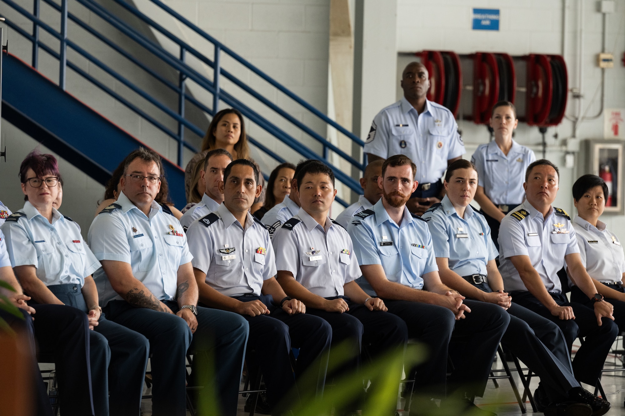 Students of the inaugural Inter-Pacific Air Forces Academy class listen to the keynote speech during their graduation ceremony, Joint Base Pearl Harbor-Hickam, Hawaii, November 16, 2023. IPAFA is a leadership course that includes all Allies and partners throughout the Indo-Pacific. The idea for IPAFA came out of the Pacific Air Chiefs Symposium 2021, and existing courses such as Airman Leadership School and Senior Non-commissioned Officer Academy that have international student enrollment on a space-available basis. (U.S. Air Force photo by Tech. Sgt. Hailey Haux)