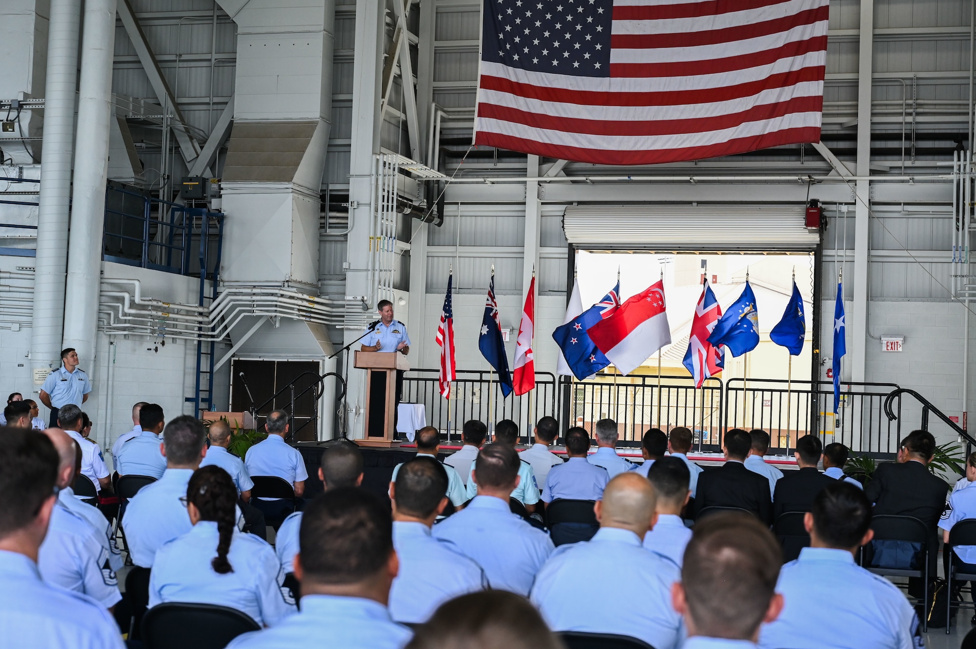 Royal Australian Air Force Air Vice-Marshal Carl Newman, Pacific Air Forces deputy commander, delivers a keynote address during the graduation ceremony of the inaugural Inter-Pacific Air Forces Academy class, Joint Base Pearl Harbor-Hickam, Hawaii, November 16, 2023. IPAFA is similar to the existing Inter-European Air Forces Academy and Inter-American Air Forces Academy, which enroll international students from Allied and partner nations within their respective regions. Those schools feature multiple courses that target different ranks and technical specialties. (U.S. Air Force photo by Tech. Sgt. Hailey Haux)