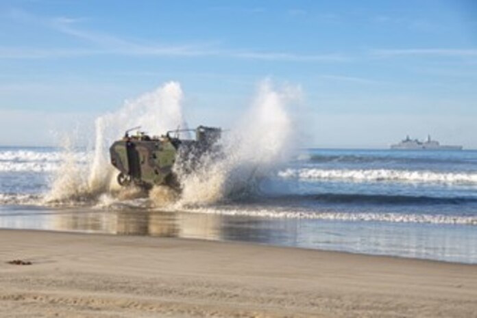 A U.S. Marine Corps Amphibious Combat Vehicle with 3d Assault Amphibian Battalion, 1st Marine Division, exits the water after conducting a shore-to-ship and ship-to-shore training event at Marine Corps Base Camp Pendleton, California. (U.S. Marine Corps photo by Cpl. Quince Bisard)