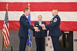 U.S. Air Force Col. Bart Van Roo, the 115th Fighter Wing commander, passes the sword to Chief Master Sgt. Michael Alvarez during the change of authority ceremony at Truax Field in Madison, Wisconsin, Nov. 4, 2023.  Alvarez took over command from Chief Master Sgt. Brian Carroll who served as the unit's senior enlisted leader since December 2020. (U.S. Air National Guard photo by Master Sgt. Mary Greenwood)