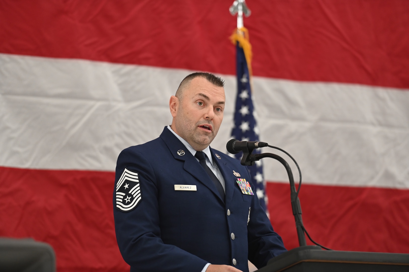 U.S. Air Force Command Chief Master Sgt. Michael Alvarez, 115th Fighter Wing command chief, speaks during the change of authority ceremony at Truax Field in Madison, Wisconsin, Nov. 4, 2023.  Alvarez took over command from Chief Master Sgt. Brian Carroll who served as the unit's senior enlisted leader since December 2020. (U.S. Air National Guard photo by Master Sgt. Mary Greenwood)