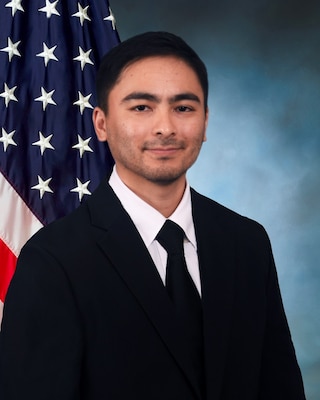 Cory Harter official photo with the American and DLA flag in background