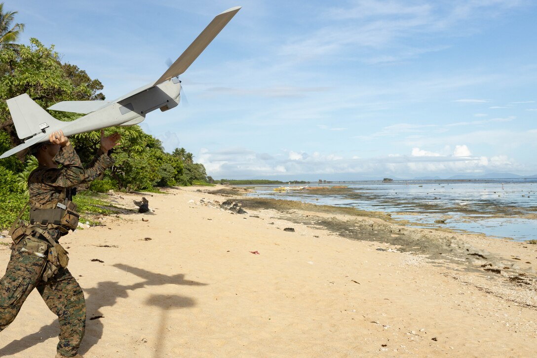 U.S. Marine Corps Sgt. Vincent Tran, a maritime sensing chief with Marine Rotational Force-Southeast Asia, I Marine Expeditionary Force, launches a RQ-20 PUMA, a small, unmanned aircraft system, at a shore-based maritime sensing site for a simulated close air support activity during MRF-SEA 23, in Sorsogon, Luzon, Philippines, Oct. 9, 2023. Sensing sites such as this one advance maritime domain awareness and improve lethality of the joint force. MRF-SEA is a Marine Corps Forces Pacific operational model which involves planned exchanges with subject matter experts, promotes security goals with Allies and partners, and positions I MEF forces west of the International Date Line.