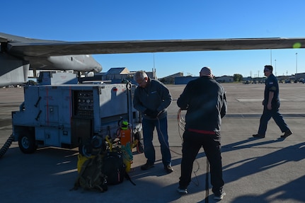 Dr. Richard Salisbury, 711th Human Performance Wing chemical biological radiological and nuclear analyst and Next Generation Aircrew Protection team member, and Mark Docter, METSS Corporation researcher and NGAP team member, set up the vapor purge testing nebulizer on Dyess Air Force Base, Texas, Nov. 7, 2023. During testing, a vapor simulant known as methyl salicylate was injected into the B-1B Lancer while sensors inside the cockpit measured how long it took the vapor to be purged while airborne. (U.S. Air Force photo by Senior Airman Sophia Robello)