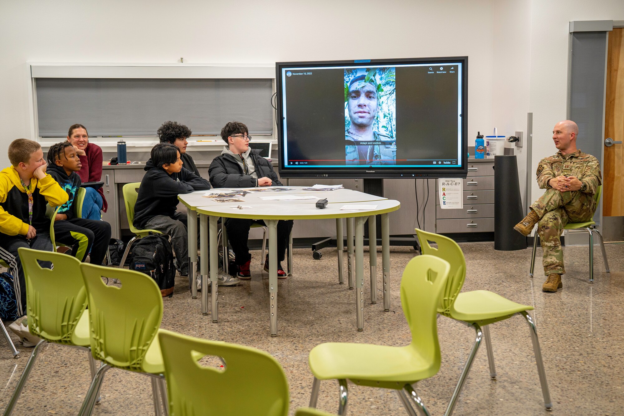 Man speaking to students.