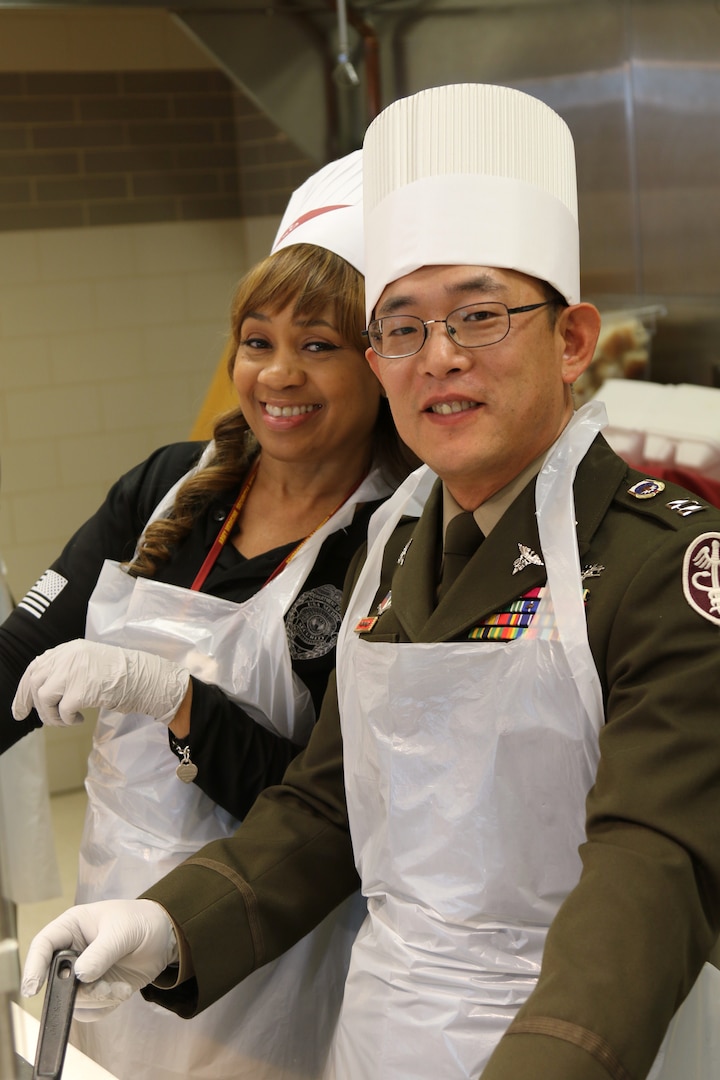 Staff serving a holiday meal.