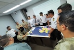 Partner nation junior officers work through a maritime planning scenario at the first-ever U.S. 4th Fleet Maritime Planning Symposium at the Peruvian Naval War College in Callao, Nov. 16, 2023.