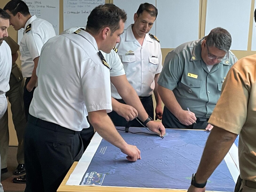 Partner nation junior officers work through a maritime planning scenario at the first-ever U.S. 4th Fleet Maritime Planning Symposium at the Peruvian Naval War College in Callao, Nov. 16, 2023.