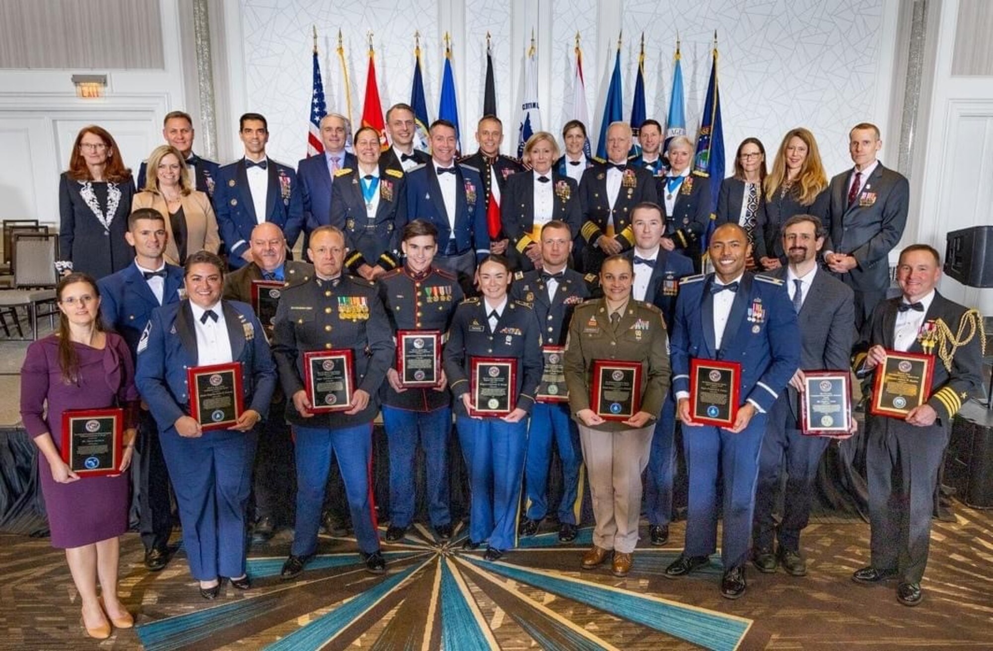 U.S. Space Force Master Sgt. Ashlee Robards, Chief, Intelligence Surveillance Reconnaissance (ISR) Tradecraft Development at Headquarters Space Training and Readiness Command, poses for a photo with fellow award winners at the National Military Intelligence Foundation's Night of Heroes banquet held in Crystal City, Virginia, on Nov. 15, 2023. Robards was named the inaugural recipient of the U.S. Space Force Intelligence Leadership Award. (Courtesy photo)