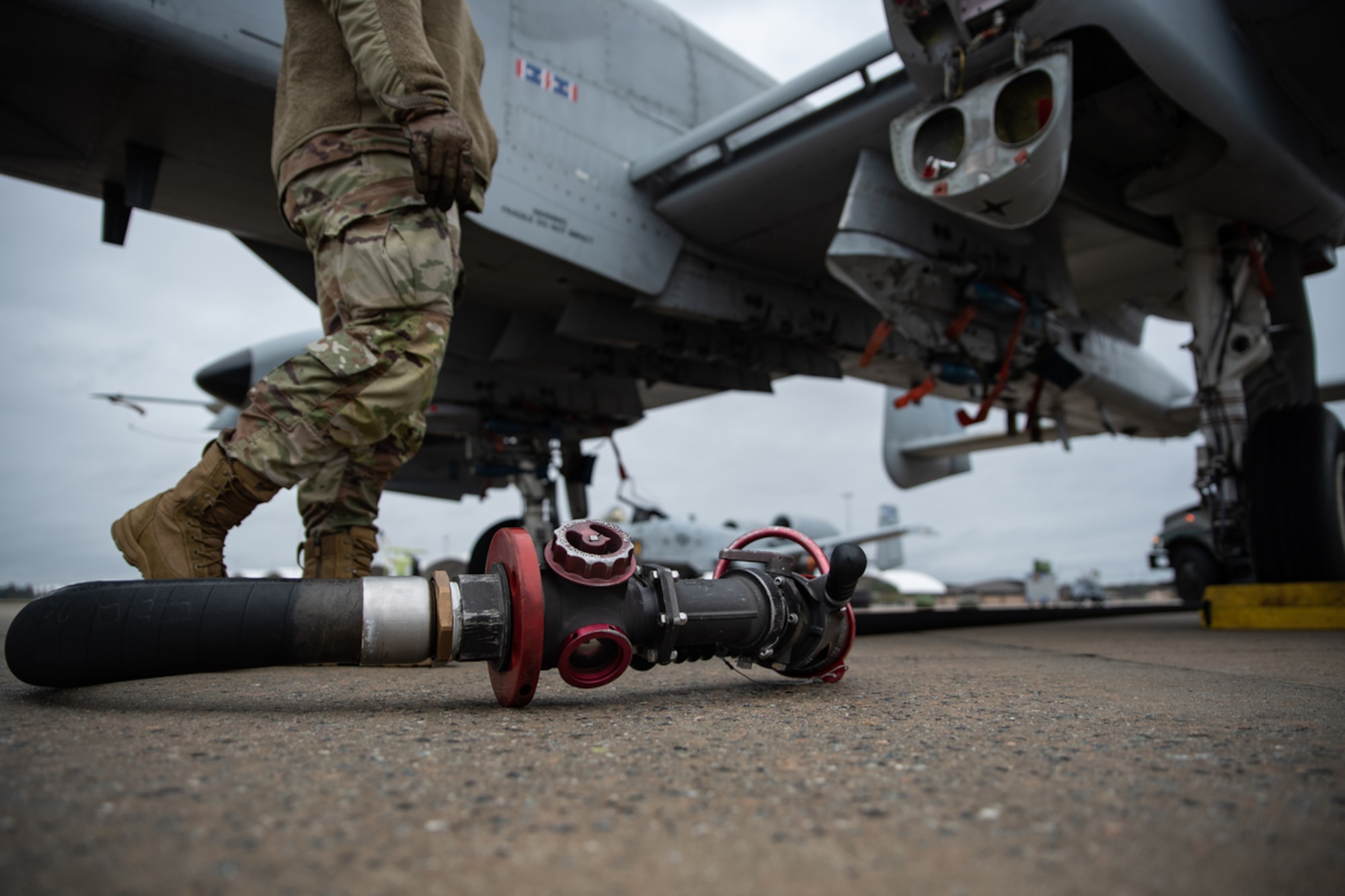 A fuel pump hose rests on the flight line during exercise Mosaic Tiger 24-1 at Moody Air Force Base, Georgia, Nov. 15, 2023. It takes between 1,000 to 1,200 gallons of fuel to refuel an A-10, and on average, A-10s are refueled 25 to 100 times a week. (U.S. Air Force photo by Andrea Jenkins)