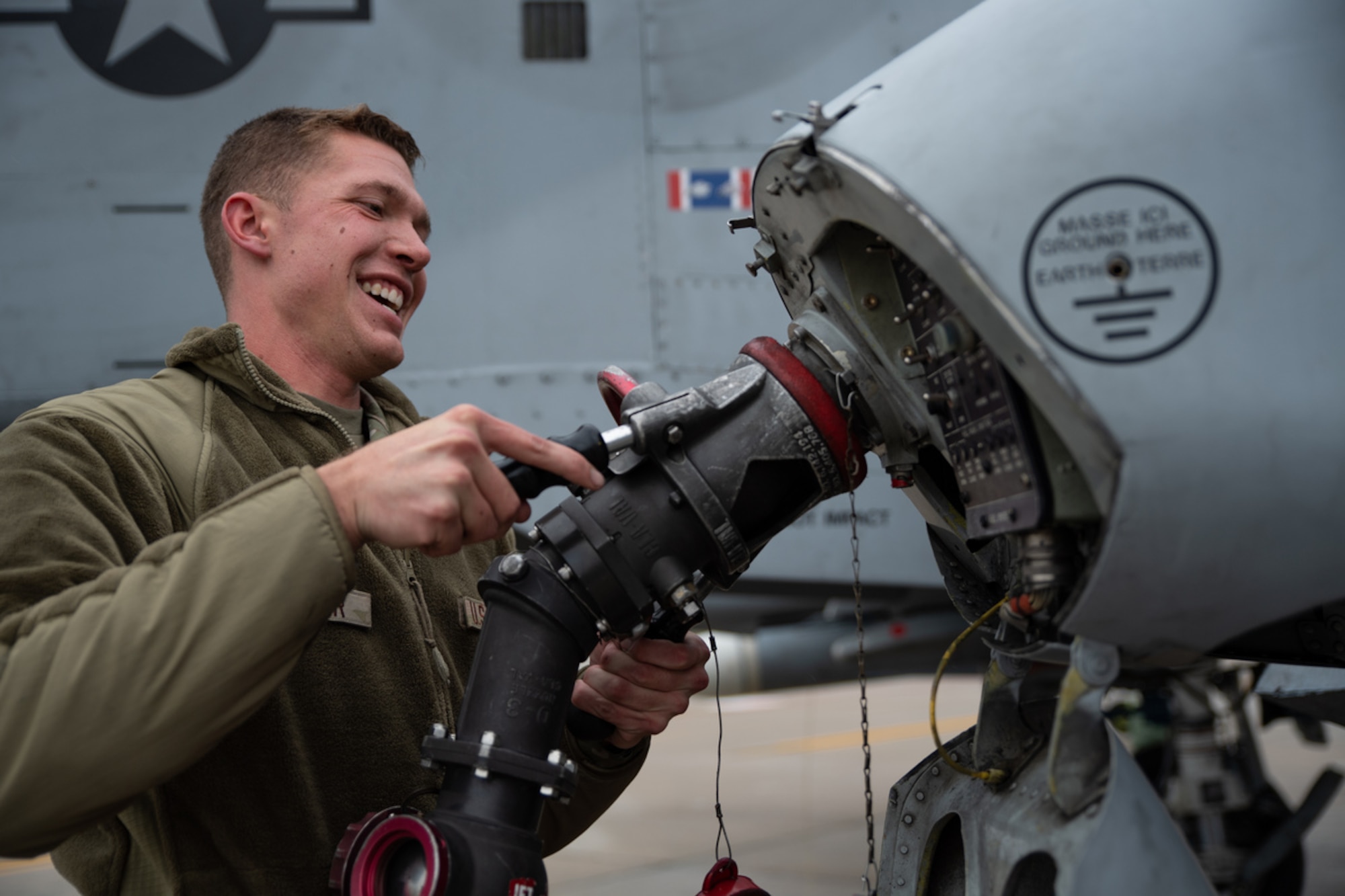 U.S. Air Force Airman 1st Class William Skinner, 74th Fighter Generation Squadron, refuels an A-10C Thunderbolt II on the flightline during exercise Mosaic Tiger 24-1 at Moody Air Force Base, Georgia, Nov. 15, 2023. On average, A-10s are refueled 25 to 100 times a week. (U.S. Air Force photo by Andrea Jenkins)