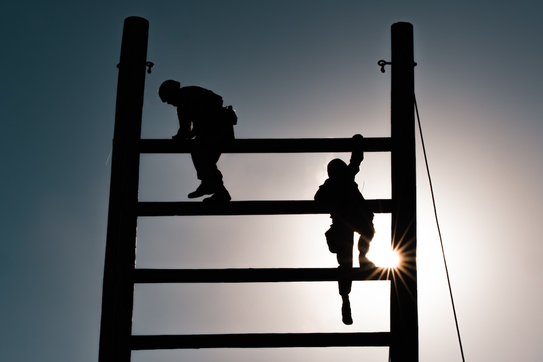 U.S. Marine Corps recruits with Kilo Company, 3rd Recruit Training Battalion, climb the ‘Stairway to Heaven’ obstacle during the Crucible at Marine Corps Base Camp Pendleton, California, Nov. 14, 2023. The Crucible is a 54-hour exercise where recruits apply the knowledge they’ve acquired throughout recruit training to earn the title United States Marine. (U.S. Marine Corps photo by Cpl. Devereux)