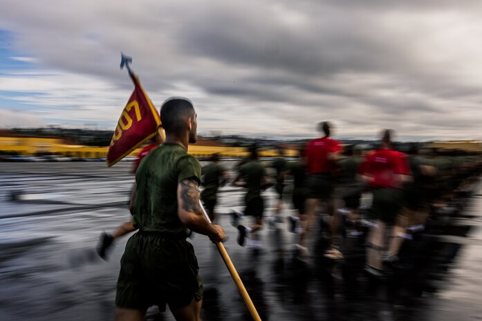 A new U.S. Marine with Alpha Company, 1st Recruit Training Battalion, participates in a motivational run at Marine Corps Recruit Depot San Diego, Nov. 16, 2023. The motivational run is the final training event the Marines complete before graduating and consists of a three-mile run throughout the Depot. (U.S. Marine Corps photo by Lance Cpl. Jacob B. Hutchinson)