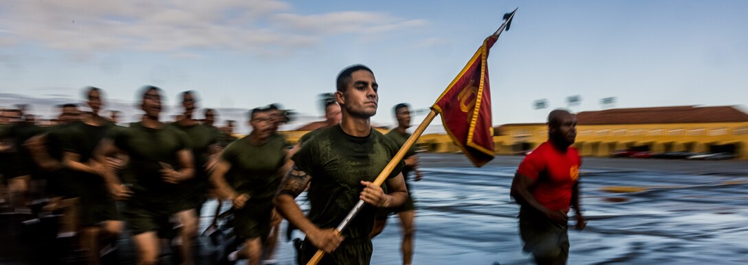 A new U.S. Marine with Alpha Company, 1st Recruit Training Battalion, participates in a motivational run at Marine Corps Recruit Depot San Diego, Nov. 16, 2023. The motivational run is the final training event the Marines complete before graduating and consists of a three-mile run throughout the Depot. (U.S. Marine Corps photo by Lance Cpl. Jacob B. Hutchinson)