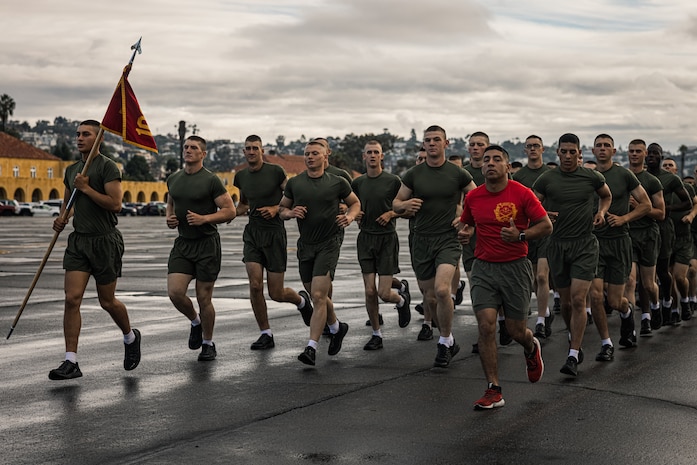 New U.S. Marines with Alpha Company, 1st Recruit Training Battalion, participate in a motivational run at Marine Corps Recruit Depot San Diego, Nov. 16, 2023. The motivational run is the final training event the Marines complete before graduating and consists of a three-mile run throughout the Depot. (U.S. Marine Corps photo by Lance Cpl. Jacob B. Hutchinson)