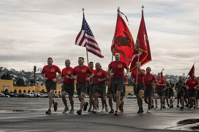 U.S. Marines with Alpha Company, 1st Recruit Training Battalion, lead a motivational run at Marine Corps Recruit Depot San Diego, Nov. 16, 2023. The motivational run is the final training event new Marines complete before graduating and consists of a three-mile run throughout the Depot. (U.S. Marine Corps photo by Lance Cpl. Jacob B. Hutchinson)