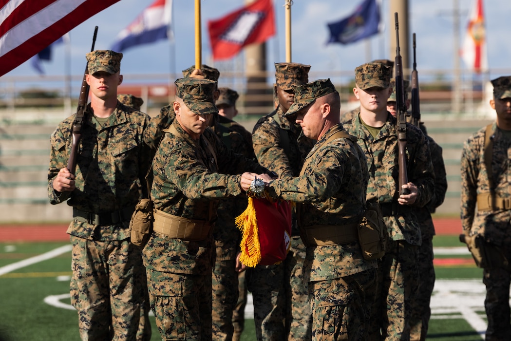 U.S. Marine Corps Col. Peter Eltringham, 12th Marine Littoral Regiment Commanding Officer, retires 12th Marines’ unit colors during the redesignation ceremony of 12th Marines to 12th MLR on Camp Hansen, Okinawa, Japan, Nov. 15, 2023. 12th MLR is designed to deploy on short notice, persist inside an engagement area, and degrade an adversary’s decision-making ability. 12th MLR’s forward presence in the first island chain contributes to integrated deterrence efforts and ensures they are postured to quickly respond to a range of crises or contingencies. (U.S. Marine Corps photo by Cpl. Scott Aubuchon)