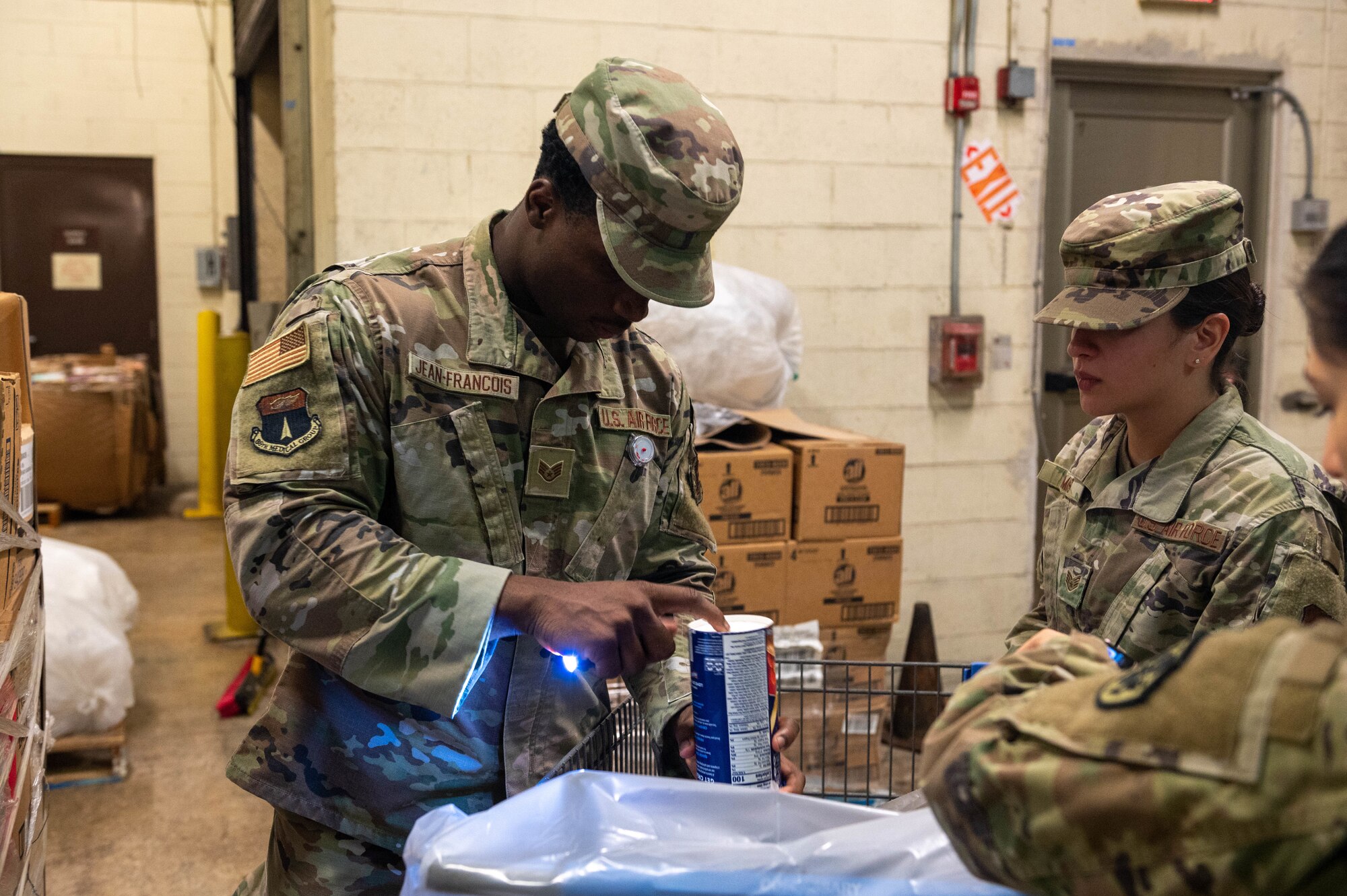 U.S. Air Force Airmen with the 36th Medical Group Public Health and the Defense Commissary Agency, inspects goods being ship to the commissary at Andersen Air Force Base, Guam, Nov. 18, 2023.