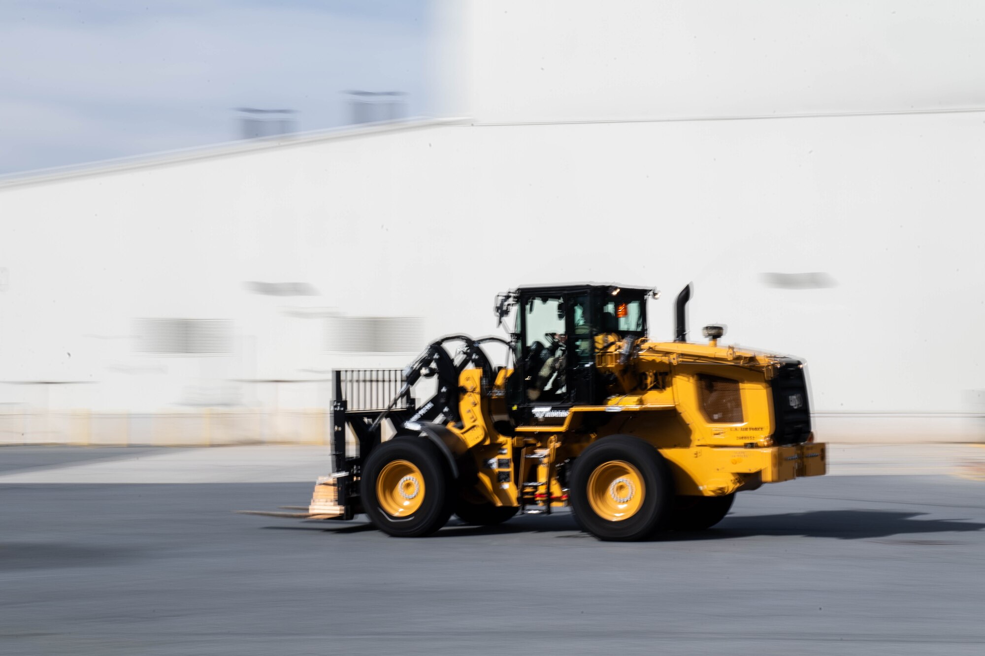 U.S. Air Force Airman 1st Class Brendan Girard, 436th Aerial Port Squadron air transportation specialist, drives a 10K AT forklift at Dover Air Force Base, Delaware, Nov. 17, 2023. 436th APS and 436th Logistic Readiness Squadron practiced preparing the 10K AT Forklift for transportation in response to short-notice taskings. The 436th Mission Generation Group Tactics Team organized the event to strengthen points of interaction between the different squadrons within the group. (U.S. Air Force photo by Tech. Sgt. J.D. Strong II)