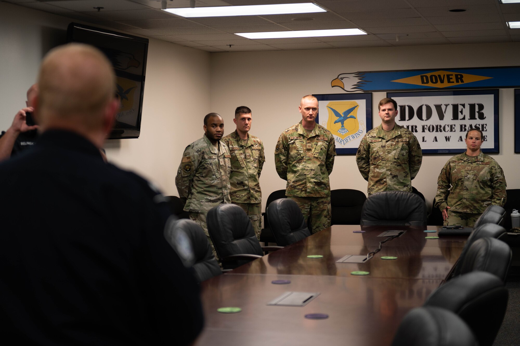 436th Mission Generation Group Airmen stand during a Military Customs Officer–Excepted program graduation at Dover Air Force Base, Delaware, Nov. 7, 2023. The Military Customs Officer–Excepted (MCO-E) program training entails eight hours of classroom and hands-on on-the-job training, that allows the military customs officers to clear arriving active U.S. military crew and their cargo. (U.S. Air Force photo by Tech. Sgt. J.D. Strong II)