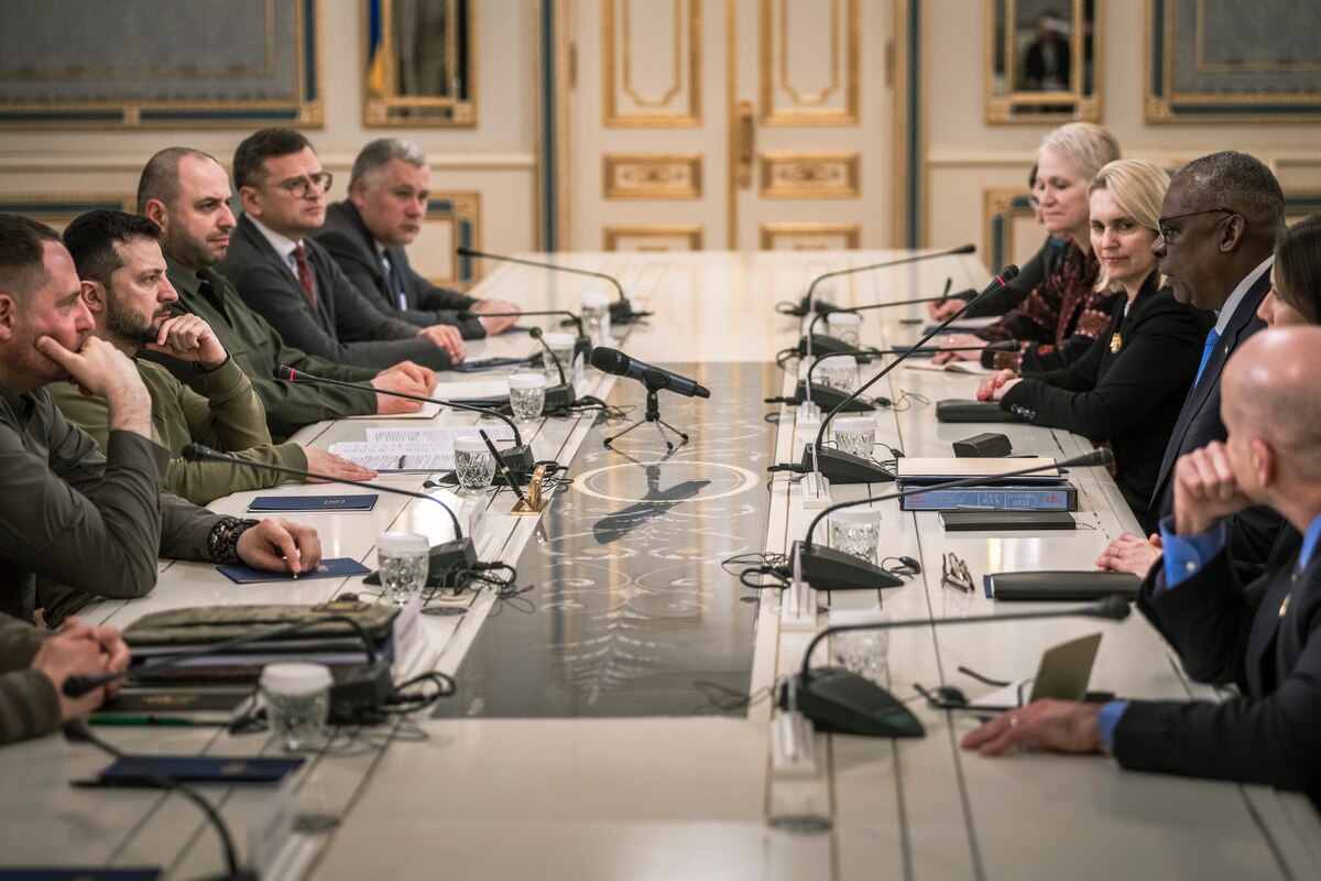 A group of people gather at a table.