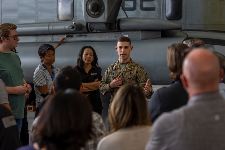 U.S. Marine Corps Chief Warrant Officer 2 Joshua Dickison, an avionics officer with Marine Heavy Helicopter Squadron (HMH) 361, Marine Aircraft Group 16, 3rd Marine Aircraft Wing, briefs MUOS Program Office personnel on the use of MUOS technology in support of heavy-lift helicopter operations at Marine Corps Air Station Miramar, California, Nov. 16, 2023. Members of Space Systems Command and the MUOS Program Office engaged with 3rd MAW and I Marine Expeditionary Force Marines to understand end-user considerations and see MUOS used at the tactical level. MUOS elevates Marine Corps warfighting capabilities by enhancing long-range, rapid communication and expanding the operational reach of the U.S. Armed Forces. (U.S. Marine Corps Photo by Cpl. Daniel Childs)
