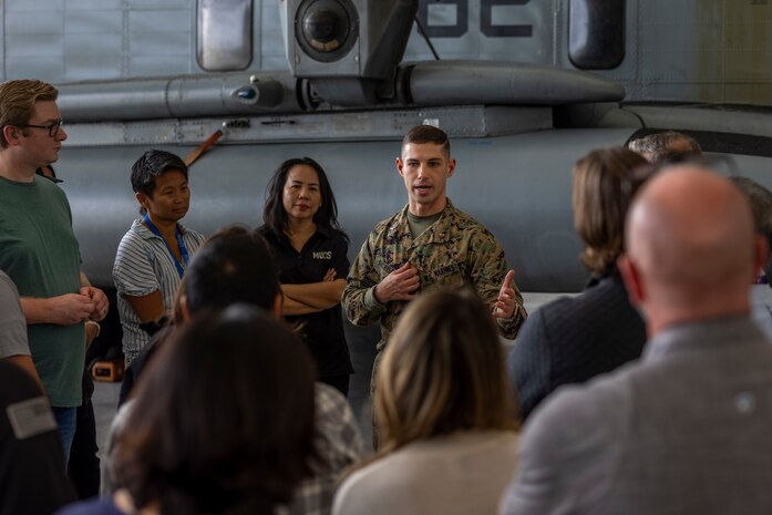 U.S. Marine Corps Chief Warrant Officer 2 Joshua Dickison, an avionics officer with Marine Heavy Helicopter Squadron (HMH) 361, Marine Aircraft Group 16, 3rd Marine Aircraft Wing, briefs MUOS Program Office personnel on the use of MUOS technology in support of heavy-lift helicopter operations at Marine Corps Air Station Miramar, California, Nov. 16, 2023. Members of Space Systems Command and the MUOS Program Office engaged with 3rd MAW and I Marine Expeditionary Force Marines to understand end-user considerations and see MUOS used at the tactical level. MUOS elevates Marine Corps warfighting capabilities by enhancing long-range, rapid communication and expanding the operational reach of the U.S. Armed Forces. (U.S. Marine Corps Photo by Cpl. Daniel Childs)
