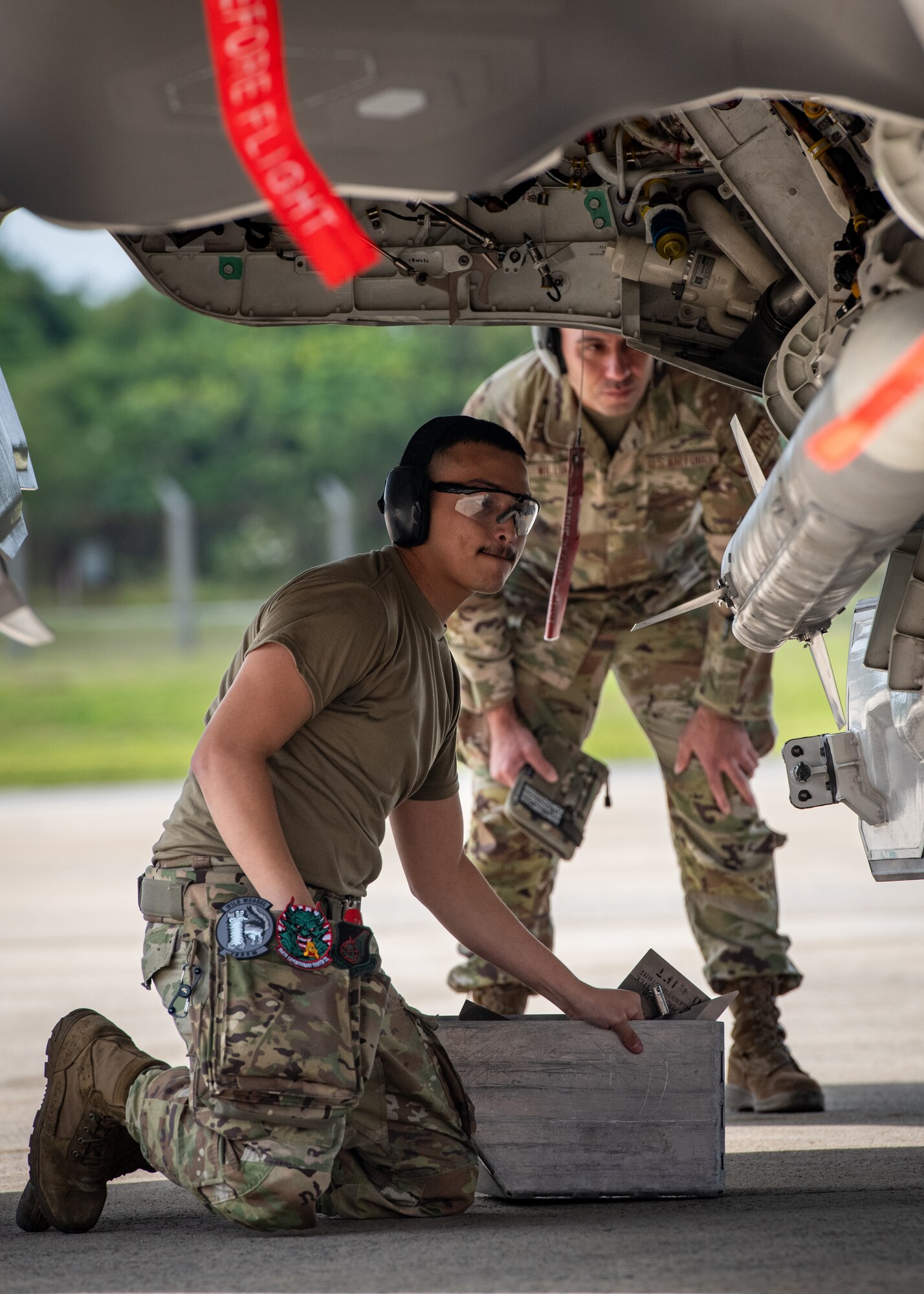 An Airman from the 356th Fighter Generation Squadron loads an AIM-120 Advanced Medium Range Air-to-Air Missile onto an F-35A Lightning II during a weapons load competition at Kadena Air Base, Japan, Nov. 17, 2023. The 356th FGS is deployed to Kadena to support deployed F-35As that are maintaining U.S. fifth-generation fighter presence in over and around Japan’s south-west islands. (U.S. Air Force Photo by Lt. Col. Raymond Geoffroy)