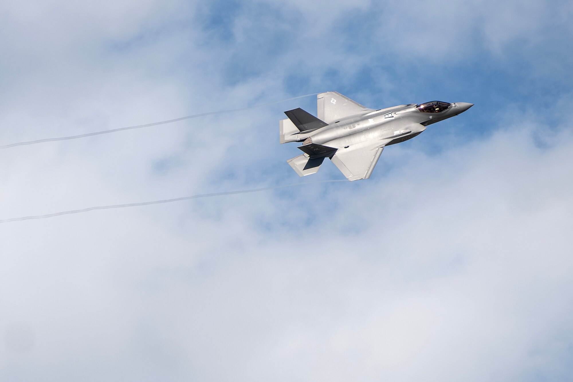 An F-35A Lightning II assigned to the 4th Fighter Squadron, Hill Air Force Base, Utah, flies overhead at Kadena Air Base, Japan, Nov. 20, 2023. The F-35A is an agile, versatile, high-performance, multi-role fighter that combines stealth, sensor fusion and unprecedented situational awareness. (U.S. Air Force photo by Staff Sgt. Jessi Roth)