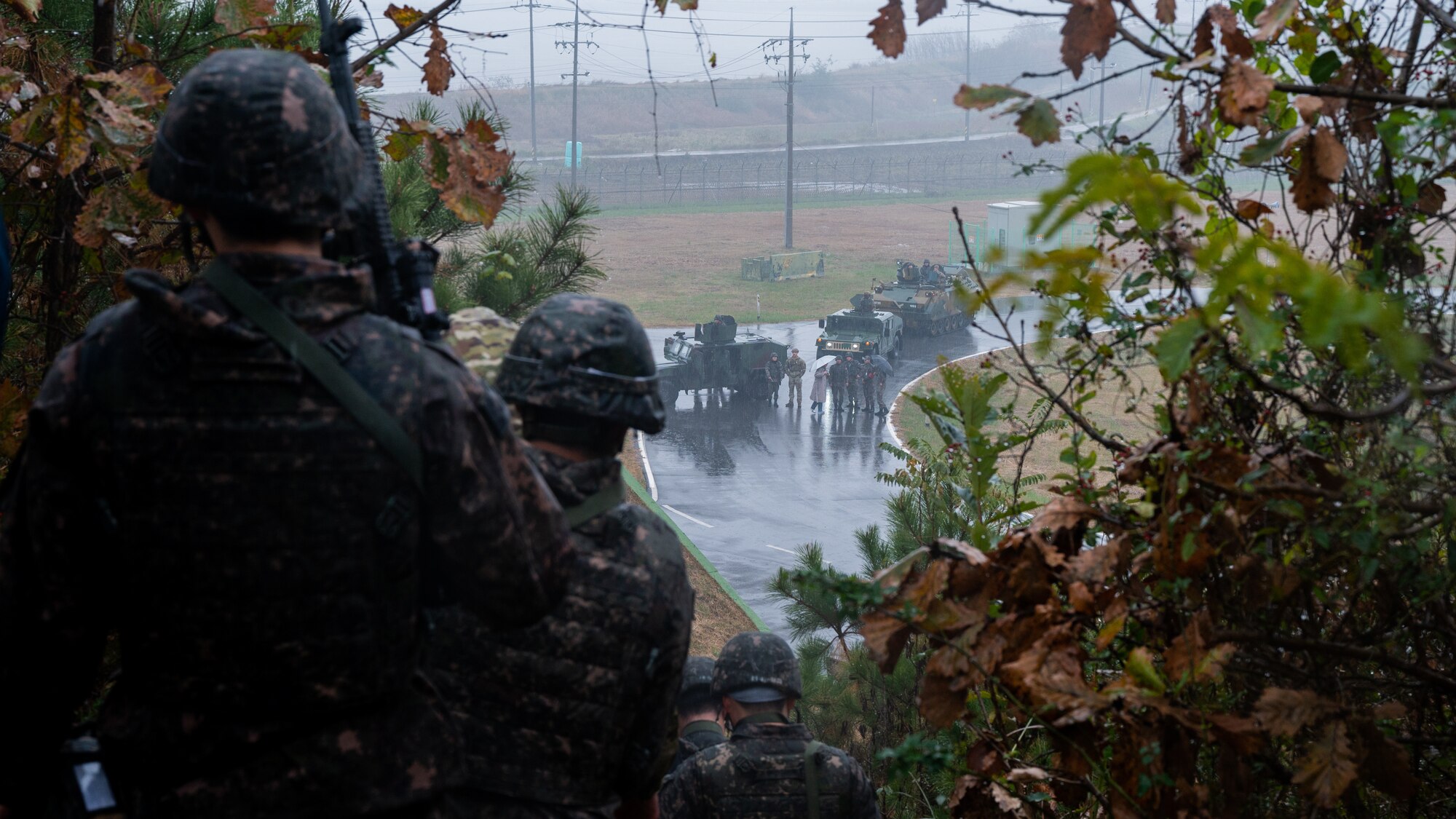 Republic of Korea Air Force 38th Fighter Group military police and U.S. Air Force 8th Security Forces Squadron defenders return to a convoy after apprehending oppositional force members during an anti-terrorism response exercise.