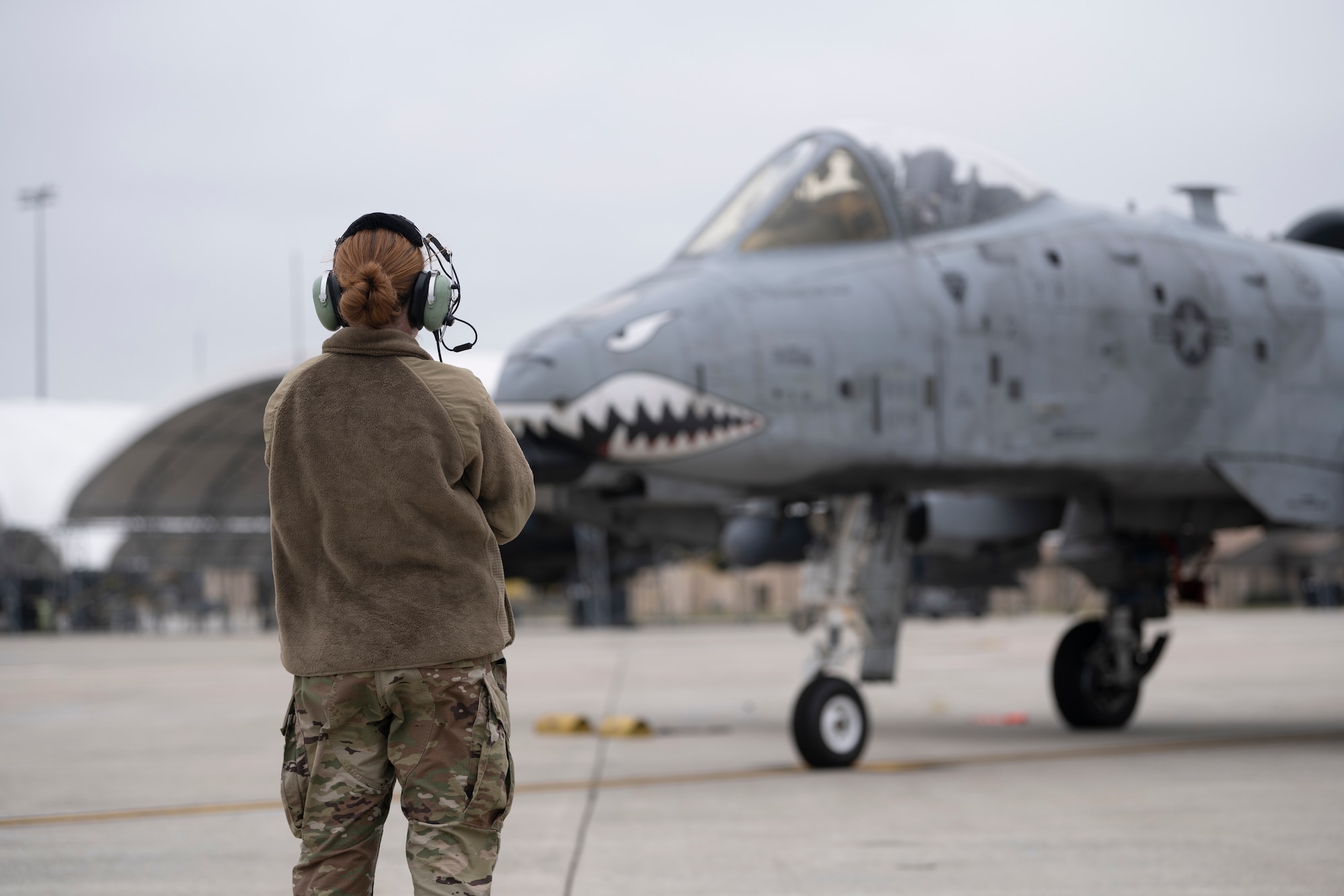 An Airman marshals out an A-10C Thunderbolt II