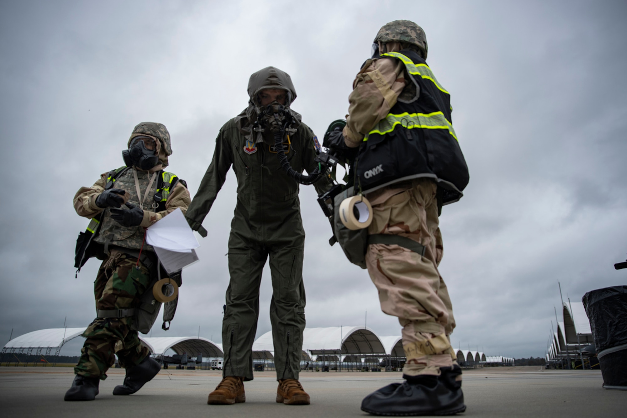 Airmen wear MOPP gear on the flightline