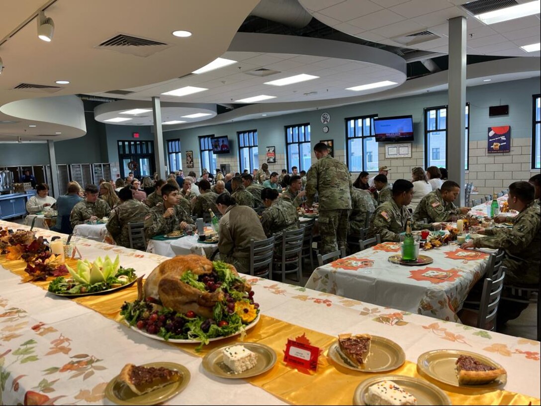 U.S. servicemembers enjoy a holiday meal in Fort McCoy, Wisconsin, Nov. 8, 2023. Defense Logistics Agency Troop Support supplies America's armed forces with over $19 billion annually of food, uniforms, protective equipment, medicine, medical supplies, construction and equipment.