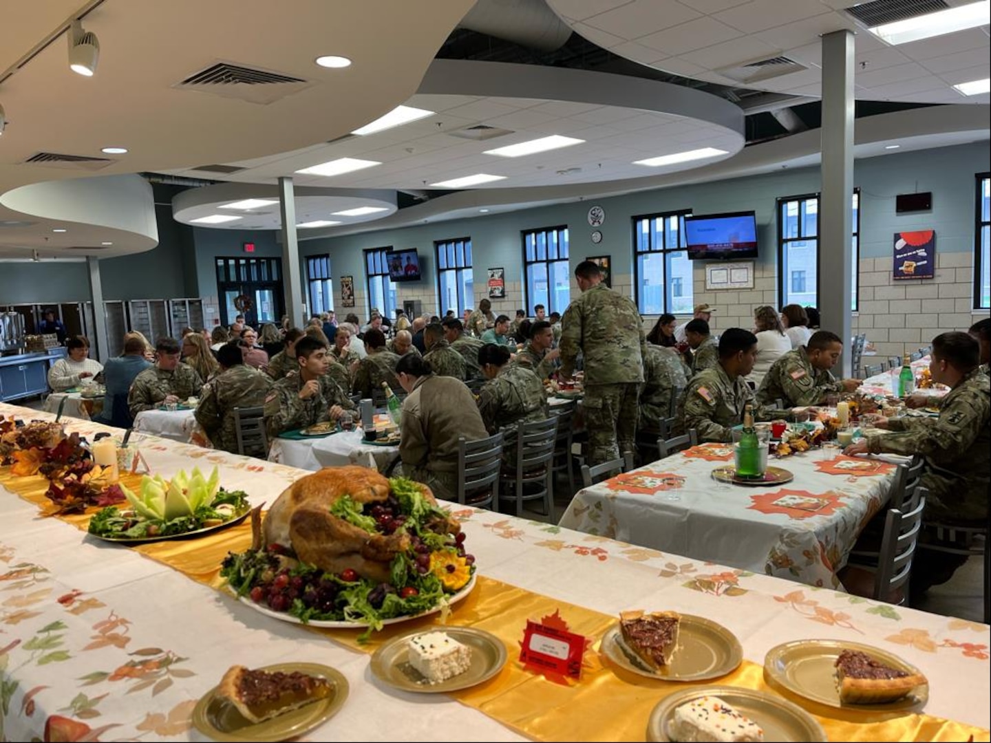 U.S. servicemembers enjoy a holiday meal in Fort McCoy, Wisconsin, Nov. 8, 2023. Defense Logistics Agency Troop Support supplies America's armed forces with over $19 billion annually of food, uniforms, protective equipment, medicine, medical supplies, construction and equipment.
