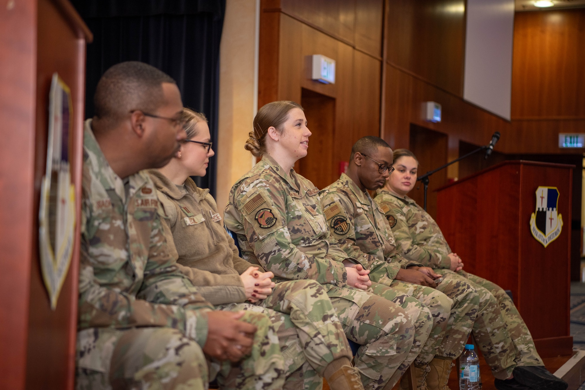 Airmen speak at a panel.