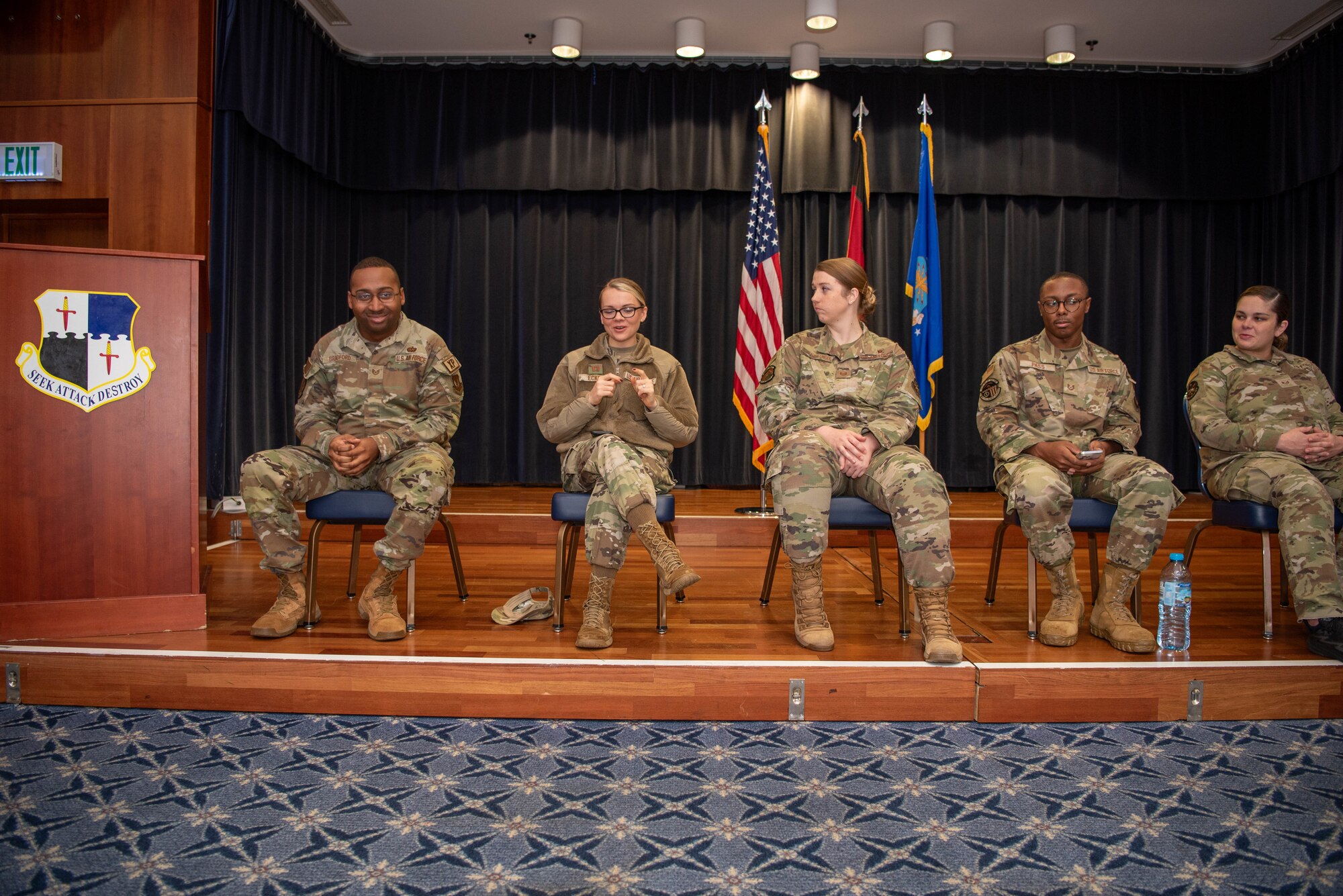 Airmen speak at a panel.