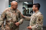 Gen. Anthony J. Cotton commander of U.S. Strategic Command, receives a squadron patch from Capt. Kai Billings, Operations Flight Commander for the 22nd Surveillance Squadron, during Cotton’s visit to the Air Force Technical Applications Center, Patrick Space Force Base, Fla., Nov. 16, 2023.  Billings briefed the general on his squadron’s role in nuclear deterrence and global surveillance operations.  (U.S. Air Force photo by Matthew S. Jurgens)