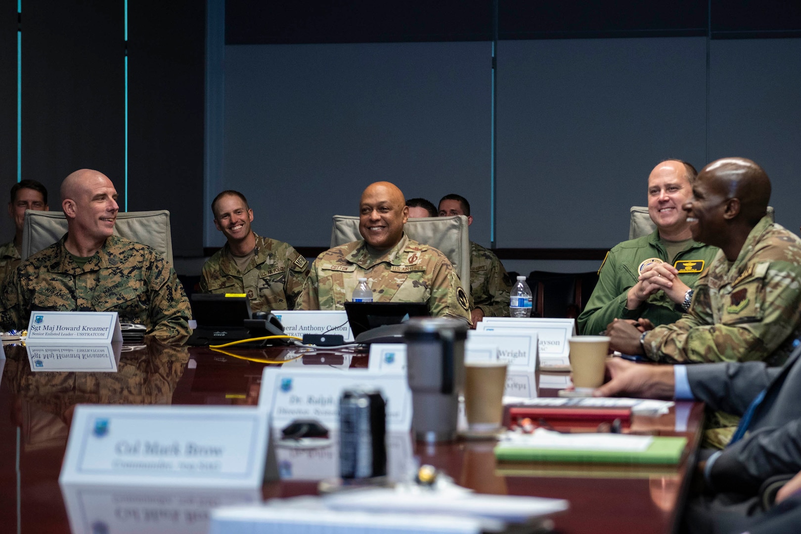 Gen. Anthony J. Cotton (center) commander of U.S. Strategic Command, sits alongside his Command Senior Enlisted Advisor Sgt. Maj. Howard Kreamer (left) and his Director of Global Operations, Maj. Gen. John J. Nichols (second from right) as the commander of the Air Force Technical Operations Center Col. James A. Finlayson (right) briefs the visitors on the success his organization has achieved in strategic nuclear deterrence operations.  Cotton and his team visited the nuclear treaty monitoring center Nov. 16, 2023 for a mission update and to host a Town Hall for center personnel.  (U.S. Air Force photo by Matthew S. Jurgens)