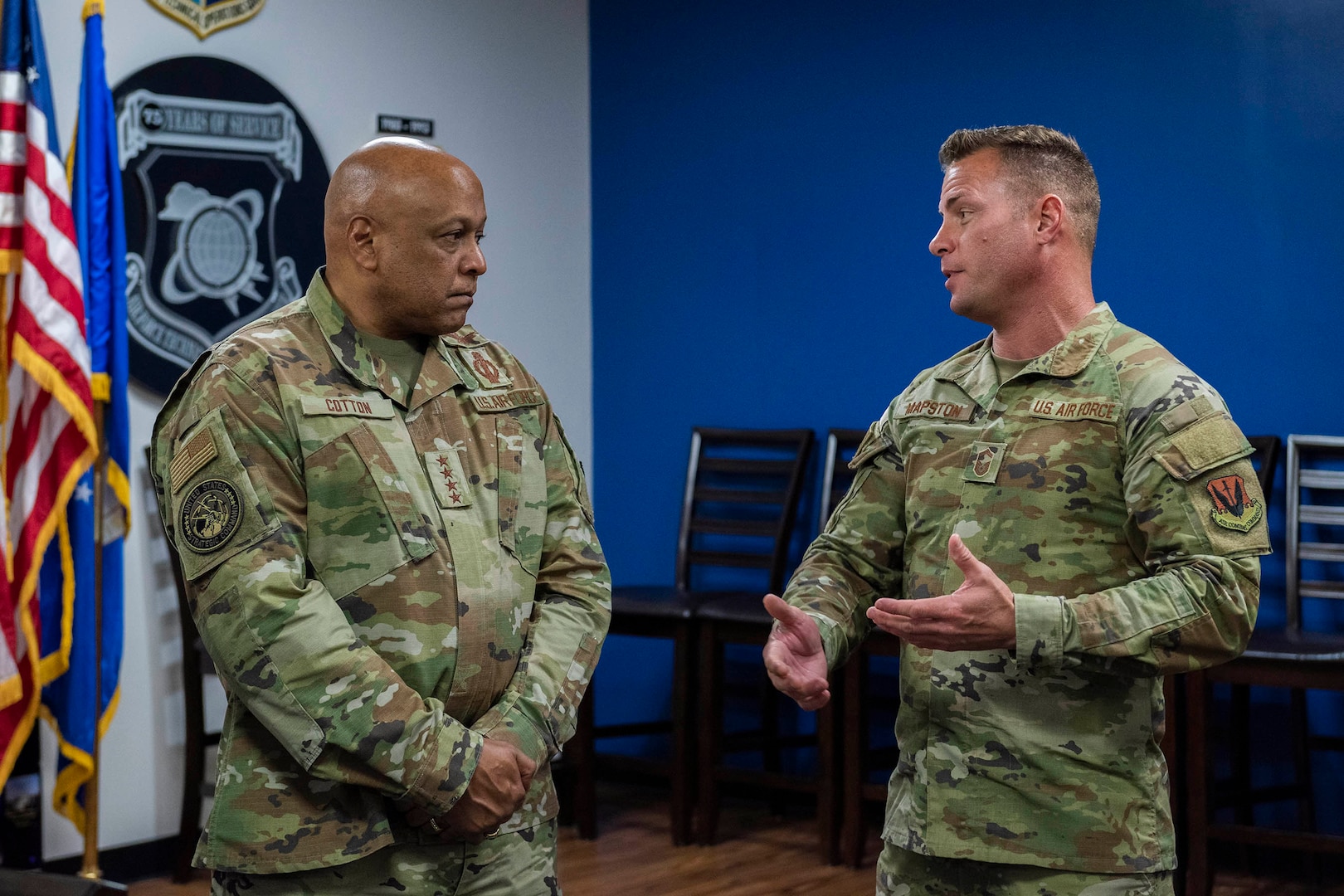 Senior Master Sgt. Brett Mapston, a member of the Air Force Technical Applications Center at Patrick Space Force Base, Fla., briefs Gen. Anthony J. Cotton commander of U.S. Strategic Command, about AFTAC’s 70+ year history of long range detection and nuclear deterrence operations.  Cotton visited the Department of Defense’s sole nuclear treaty monitoring center Nov. 16, 2023, accompanied by USSTRATCOM’s Command Senior Enlisted Leader Sgt. Maj. Howard Kreamer and his Director of Global Operations Maj. Gen. John J. Nichols.   (U.S. Air Force photo by Matthew S. Jurgens)