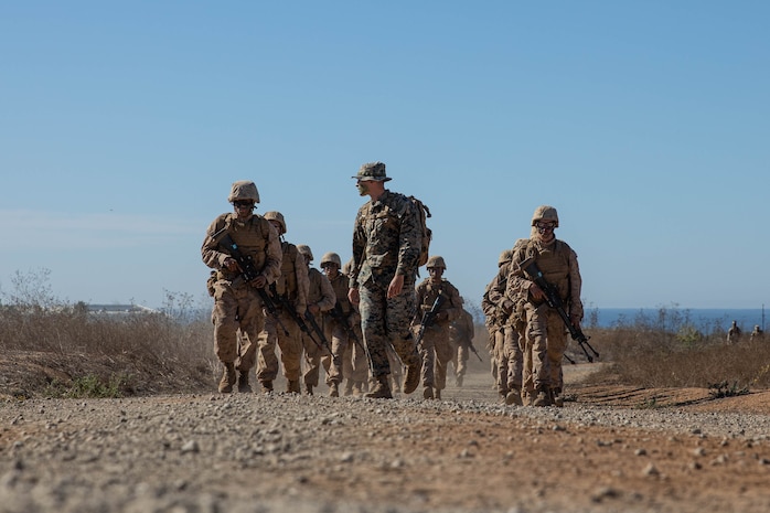 U.S. Marine Corps recruits with Kilo Company, 3rd Recruit Training Battalion, are led by Combat Instructor Sgt. Zedrickly Lotich to their next event during The Crucible on Marine Corps Base Camp Pendleton, California, Nov. 14, 2023. The Crucible is a 54-hour exercise where recruits apply the knowledge and training they’ve learned throughout recruit training to earn the title of United States Marine. Zedrickly is a native of Glens Falls, N.Y. (U.S. Marine Corps photo by Lance Cpl. Sarah M. Grawcock)