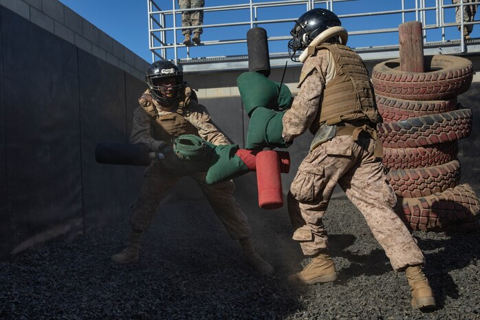 U.S. Marine Corps recruits with Kilo Company, 3rd Recruit Training Battalion, spar with pugil sticks during The Crucible on Marine Corps Base Camp Pendleton, California, Nov. 14, 2023. The Crucible is a 54-hour exercise where recruits apply the knowledge and training they’ve learned throughout recruit training to earn the title of United States Marine. (U.S. Marine Corps photo by Lance Cpl. Sarah M. Grawcock)