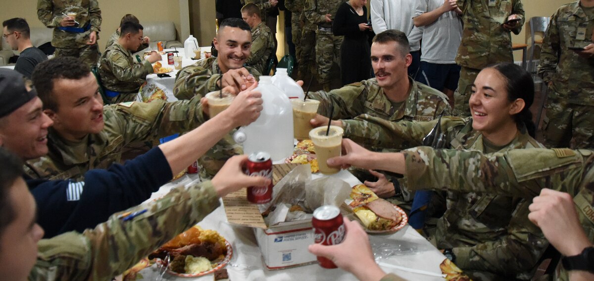 Students assigned to Goodfellow Air Force Base celebrate at the Crossroads Thanksgiving event, Goodfellow Air Force Base, Texas, Nov. 17, 2023. Students were fed and enjoyed each other's company in lieu of going home for the holiday. (U.S. Air Force Photo by Staff Sgt. Nathan Call)