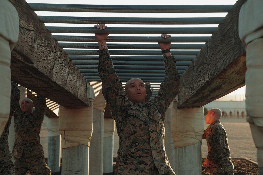 U.S. Marine Corps Sgt. Thomas Nguyen, a student with Marine Corps Recruit Depot San Diego Drill Instructor School, Recruit Training Regiment participate in an obstacle during the confidence course at MCRD San Diego, California, Nov. 14, 2023. Drill instructor school further develops the leadership, command presence, instructional ability, physical fitness, and knowledge of selected officers, staff noncommissioned and noncommissioned officers in order to successfully perform the duties of a series commander and drill instructor. Nguyen is a native of Phoenix, Arizona. (U.S. Marine Corps photo by Lance Cpl. Francisco Angel)