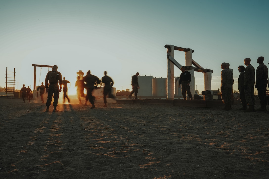 U.S. Marine Corps students with Marine Corps Recruit Depot San Diego Drill Instructor School, Recruit Training Regiment sprint to their assigned obstacles prior to conducting the confidence course at MCRD San Diego, California, Nov. 14, 2023. Drill instructor school further develops the leadership, command presence, instructional ability, physical fitness, and knowledge of selected officers, staff noncommissioned and noncommissioned officers in order to successfully perform the duties of a series commander and drill instructor. (U.S. Marine Corps photo by Lance Cpl. Francisco Angel)