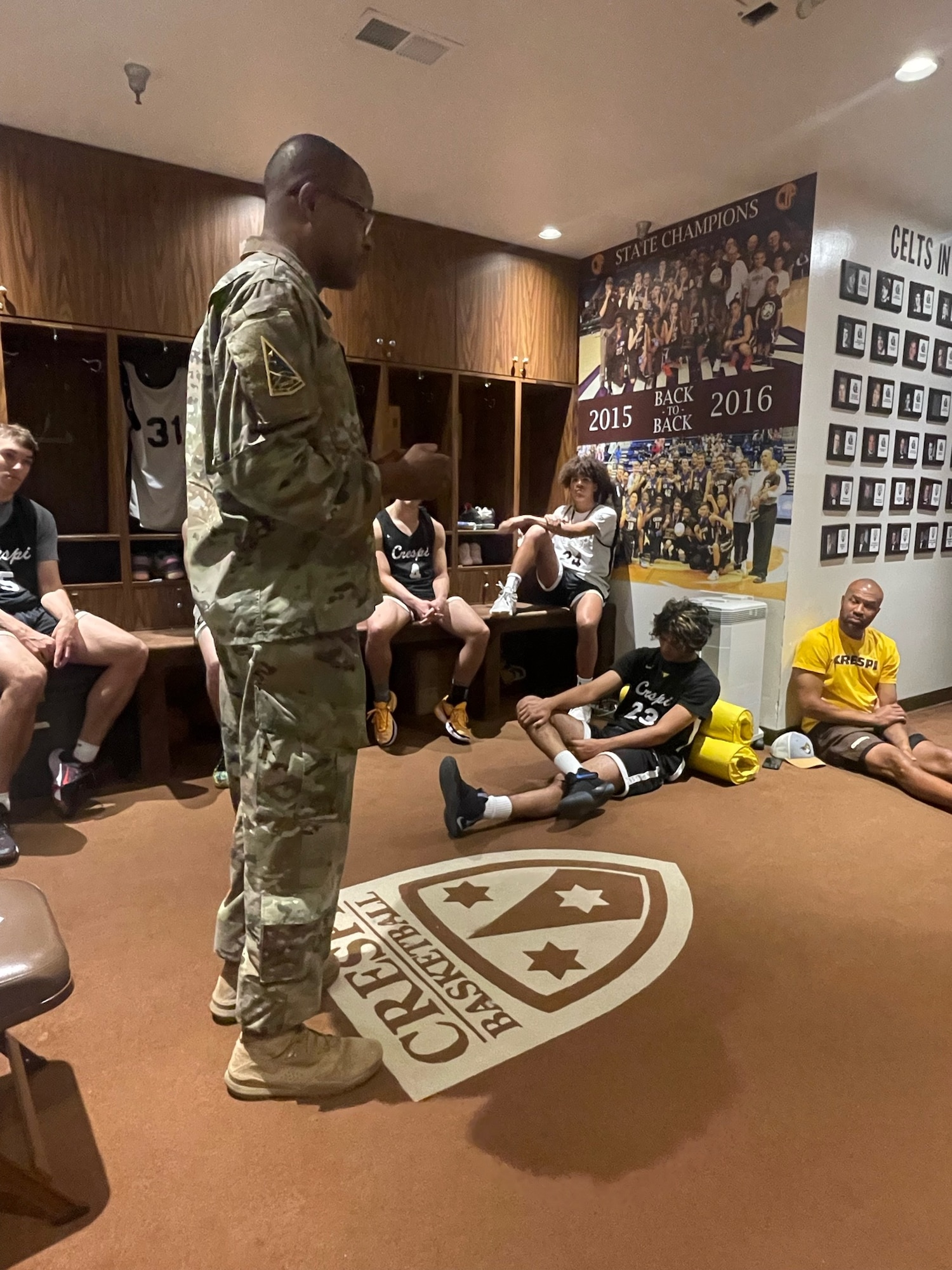 On Nov. 11, Space Systems Command’s Senior Enlisted Leader Chief Master Sgt. Willie Frazier, met with players from Crespi Highschool varsity basketball team ahead of their Veterans Day scrimmage. Los Angeles Lakers alum Derek Fisher, who coaches the team, invited Frazier to talk with the players ahead of their Veterans Day scrimmage. Frazier shared his thoughts and wisdom on commitment and what it means to put service before self. Photo by MSgt Dantae Seward, Space Systems Command.