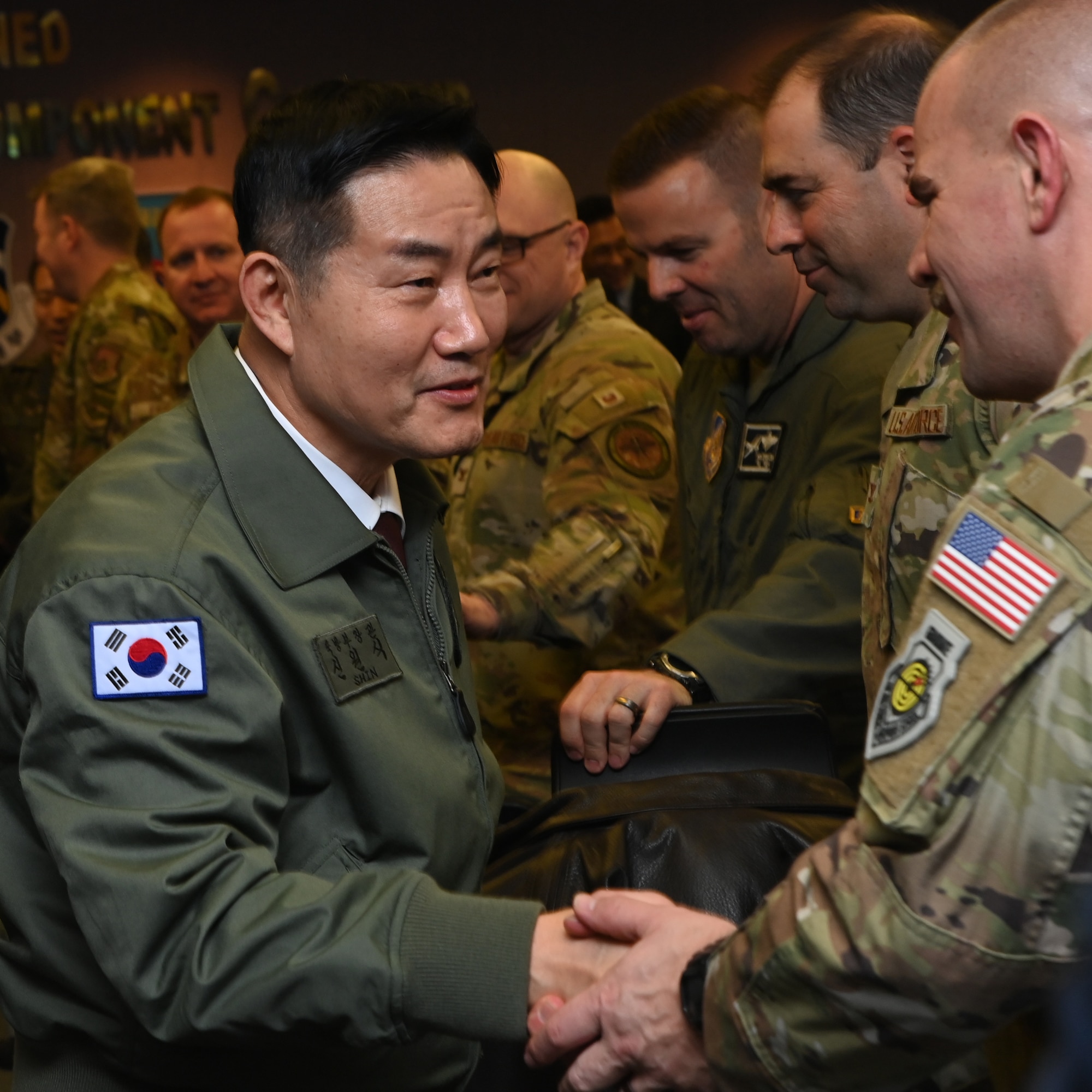 Republic of Korea Minister of National Defense Won-sik Shin greets U.S. Lt. Col. Joshua McCullion, US Space Forces Korea commander, during a visit to the 607th Air Operations Center, Osan Air Base, ROK, Nov. 21, 2023.