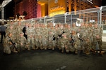 Members of the 72nd Military Police Company, Nevada National Guard, pose for a photo with state command leaders in Las Vegas Nov. 17, 2023. The 72nd MPs enhanced security at the Las Vegas Strip for the Formula 1 Grand Prix.