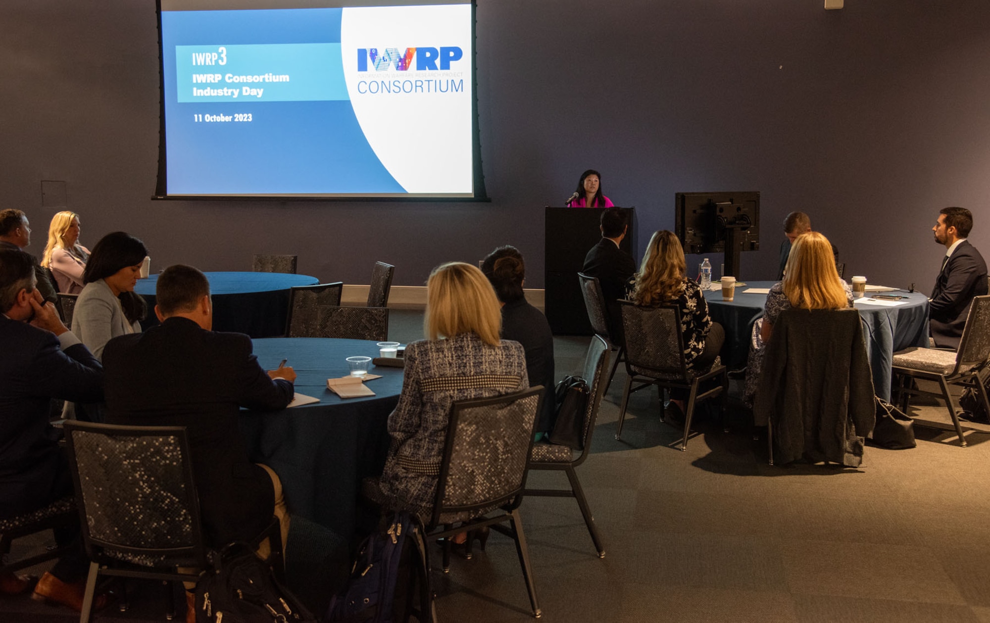 Jee Youn Fickling, Information Warfare Research Project (IWRP) program manager, gives an IWRP overview to business leaders on Oct. 11 during a Solicitation Industry Day for IWRP 3, the next iteration of the Navy’s rapid prototyping initiative.