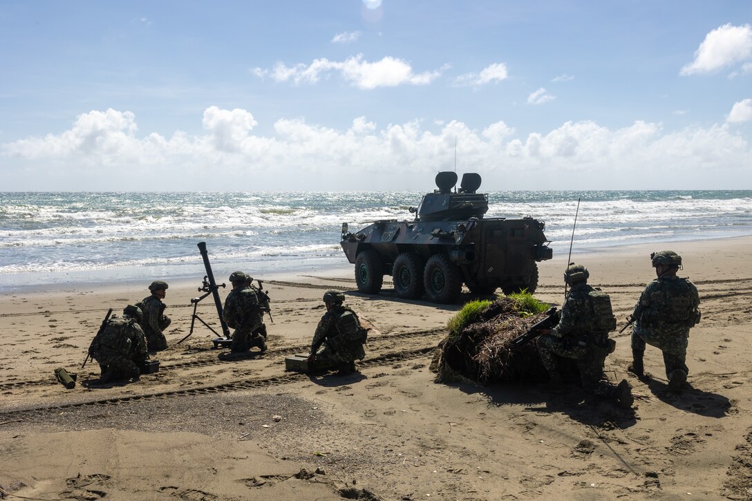Philippine Marines with 3rd Marine Brigade, Philippine Marine Corps, setup for simulated mortar coverage at a coastal defense training activity during KAMANDAG 7 on Kamuning Beach, Palawan, Philippines, Nov. 16, 2023. KAMANDAG is an annual Philippine Marine Corps and U.S. Marine Corps-led exercise aimed at improving multinational readiness and mutual capabilities in the advancement of a Free and Open Indo-Pacific. This year marks the seventh iteration of this exercise and includes participants from Japan, the Republic of Korea, and observers from the United Kingdom. MRF-SEA is a Marine Corps Forces Pacific operational model which involves planned exchanges with subject matter experts, promotes security goals with Allies and partners, and positions I MEF forces west of the International Date Line. (U.S. Marine Corps photo by Lance Cpl. Nicholas Johnson)